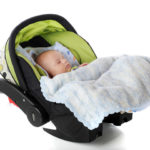 Baby in baby capsule restraint