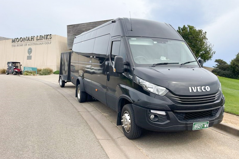 Minibus and golf trailer on golf tour to Moonah Links